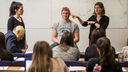 Professor Elizabeth Milne demonstrates EEG technology.