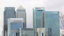 A photograph of large skyscrapers with the names of major banks.