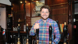 Alumnus Thomas Gill behind the bar at The Closed Shop pub