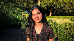 Politics student Momina Baig in front of a very green park