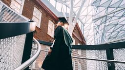 William Zheng in graduation gown in the Hearstpace