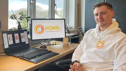 Business owner sat in front of computer for Homei