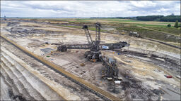 Huge open cast mining excavator, digging for ore